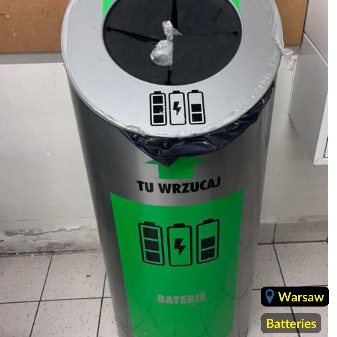 Metalic and green color waste recycling bin for batteries in Warsaw Poland