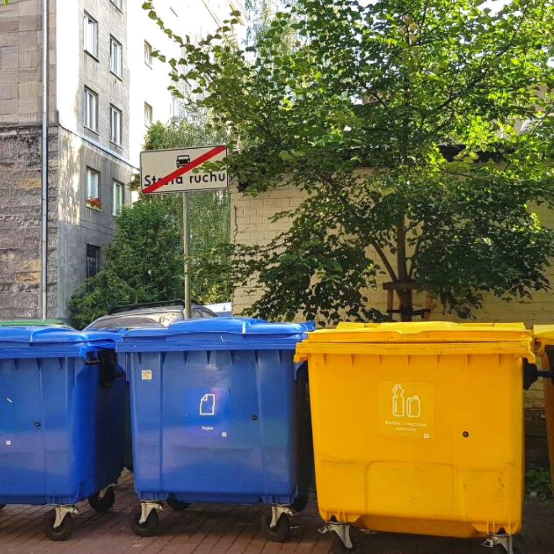 Blue waste bin for paper recycling and yellow waste bin for plastic and metal waste recycling in Warsaw Poland