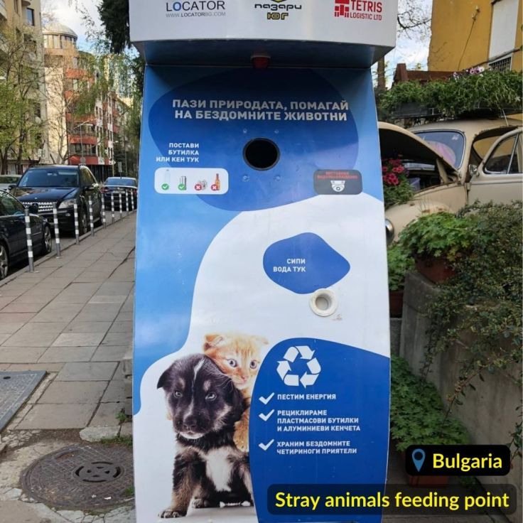 Blue and white stray animals feeding point in Bulgaria Sofia (кучемат) with a whole for recycling plastic and alluminium cans