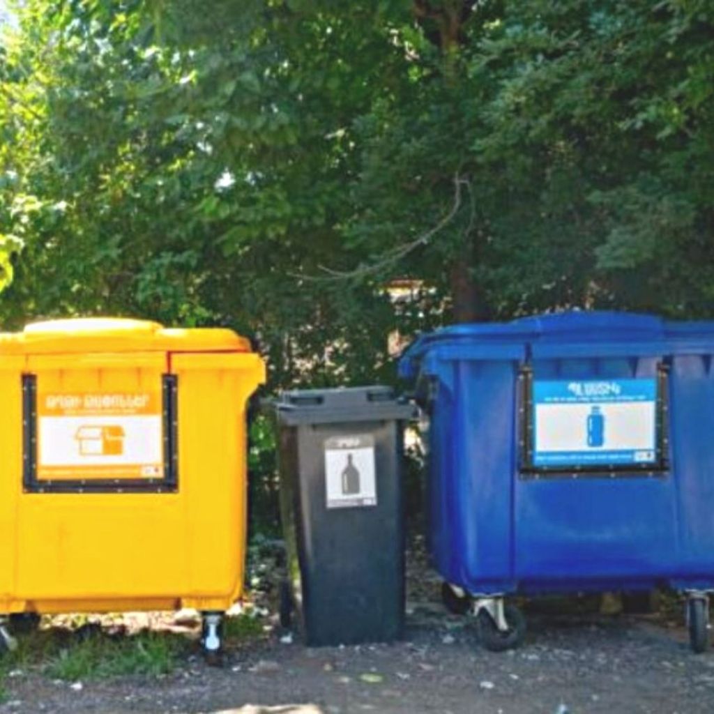 Yellow, Black and Blue recycling bins for plastic, paper and glass waste in Yerevan Armenia