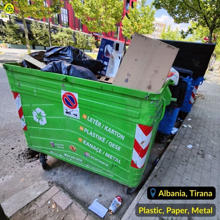 Green recycling bin for plastic, metal, paper waste in Tirana Albania