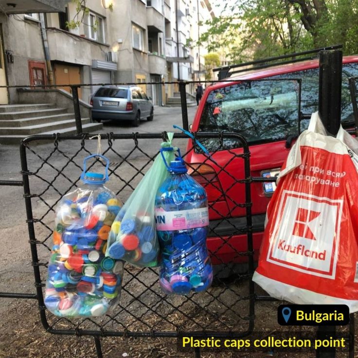 Plastic caps in the plastic bottel on the fence recycling initiative "Caps for future" (Капачки за Бъдеще) in Bulgaria Sofia
