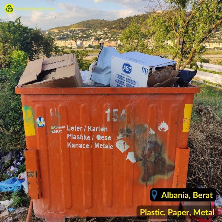 Orange recycling bin for plastic, metal, paper waste in Berat Albania