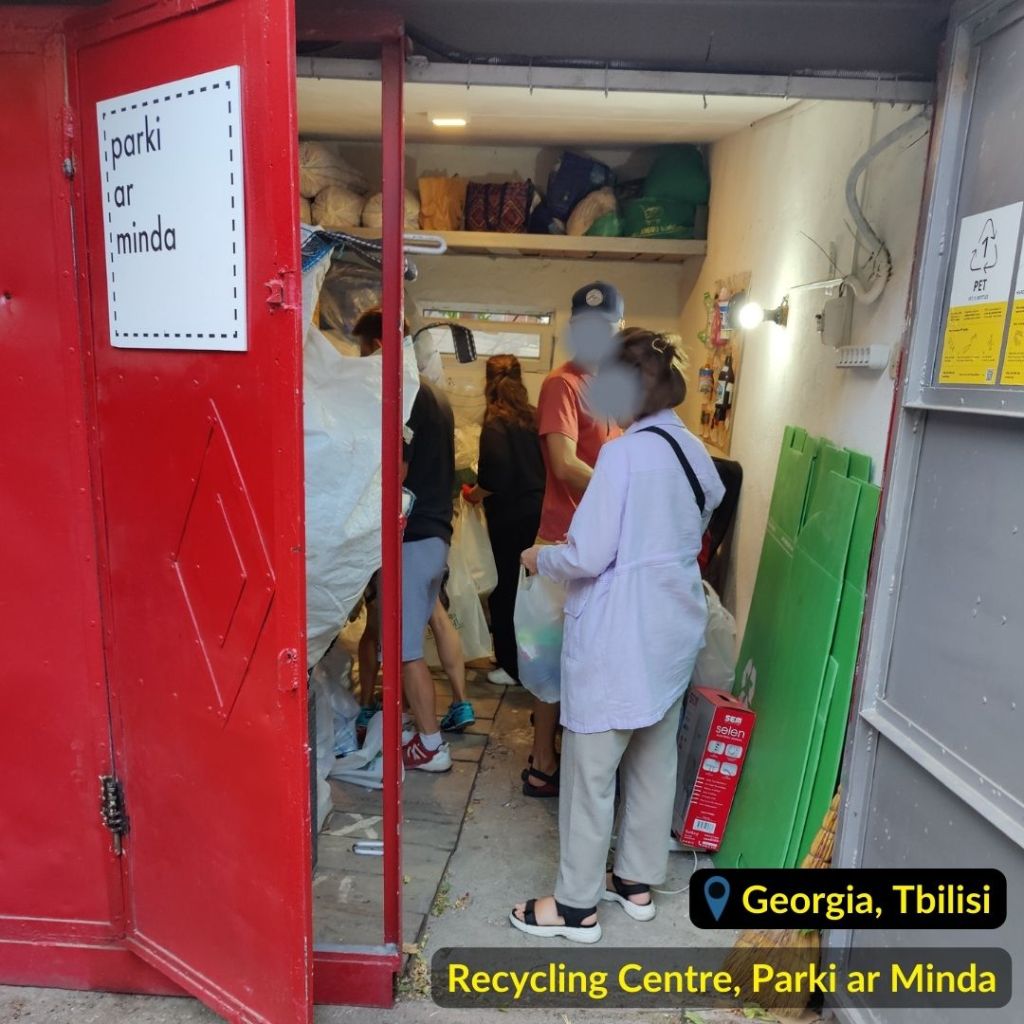Red entrance door to the garage - recycling station "Parki ar Minda" in Tbilisi Georgia