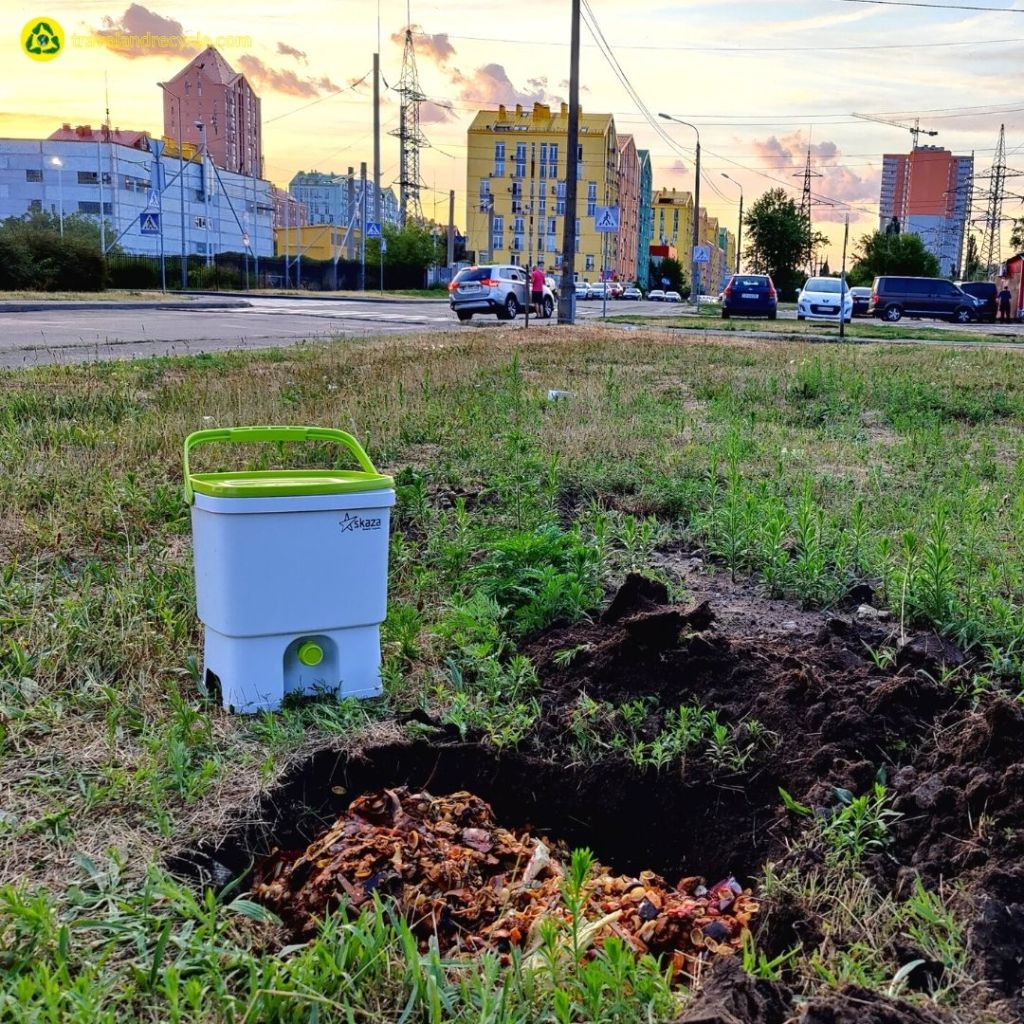 White recycling bin Skaza for organic waste bokashi composting in Kyiv Ukraine stays on the grass